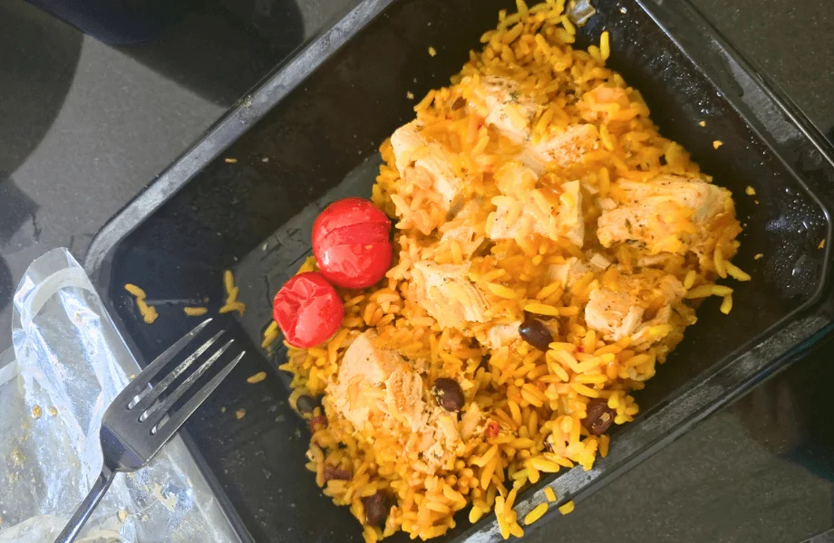 Our tester enjoying a chicken and rice bowl from Forkful meal delivery services