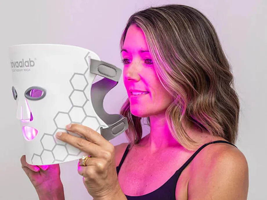 Woman holding the Novaa Lab Glow Therapy Mask