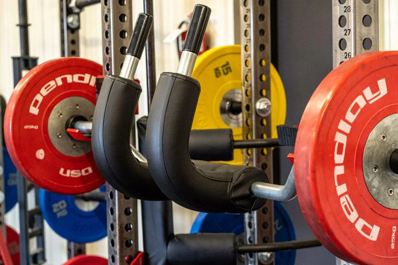 Marrs bar racked on a squat rack