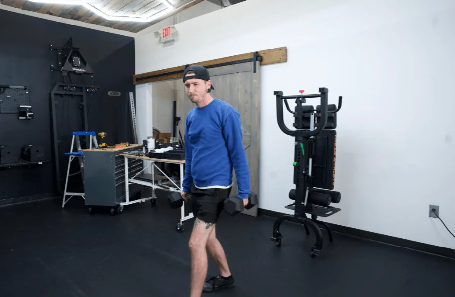 Our tester getting ready for a set of dumbbell lunges with Iron Bull Rubber Hex Dumbbells