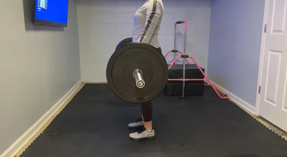 Our tester training in their home gym for our Bells of Steel Olympic weightlifting Bar 2.0 review