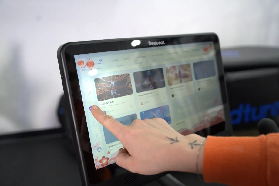 Our tester scrolls gamified programs on the Free Beat Boom Bike