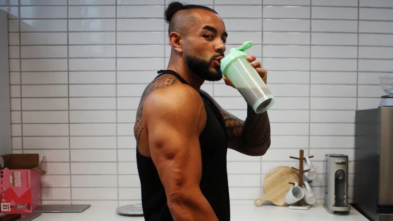 Stephen Sheehan, CPT, CNC, drinking a shake
