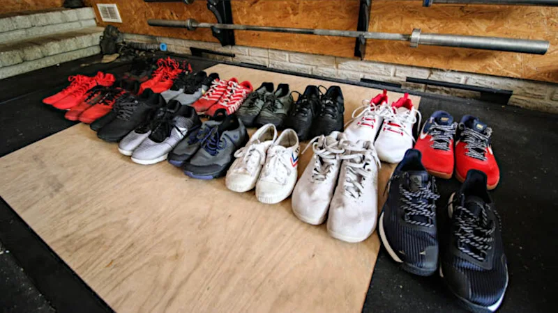 An assortment of training shoes in a garage gym