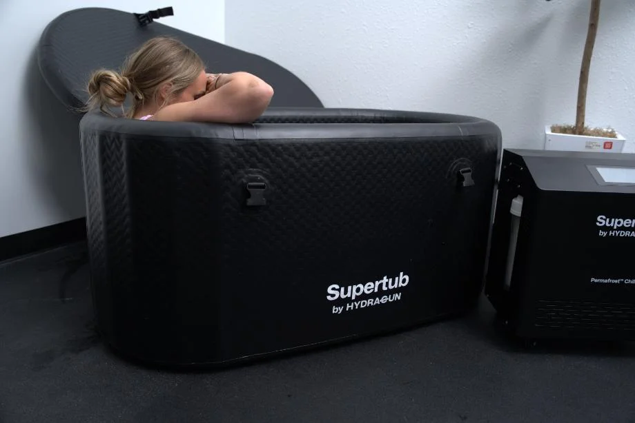 Side view of the tub in use with the logo prominently on display.