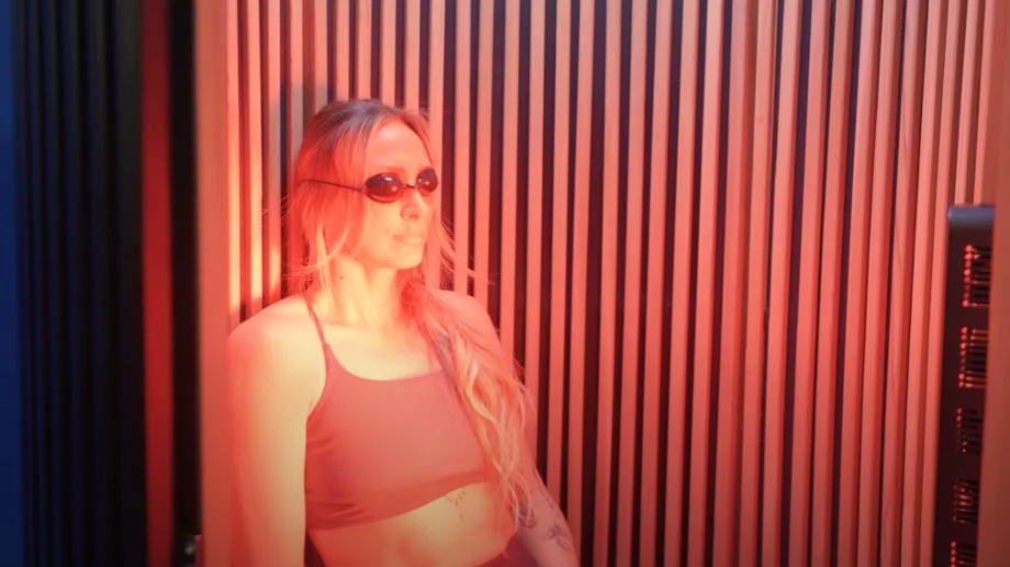 Our tester using a Sun Home Pod Sauna