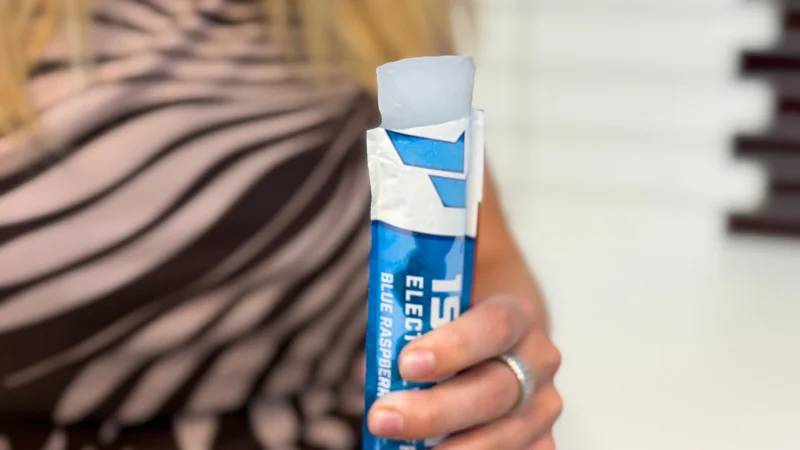 Our product tester holding a 1st Phorm Electrolyte Freezer Pop