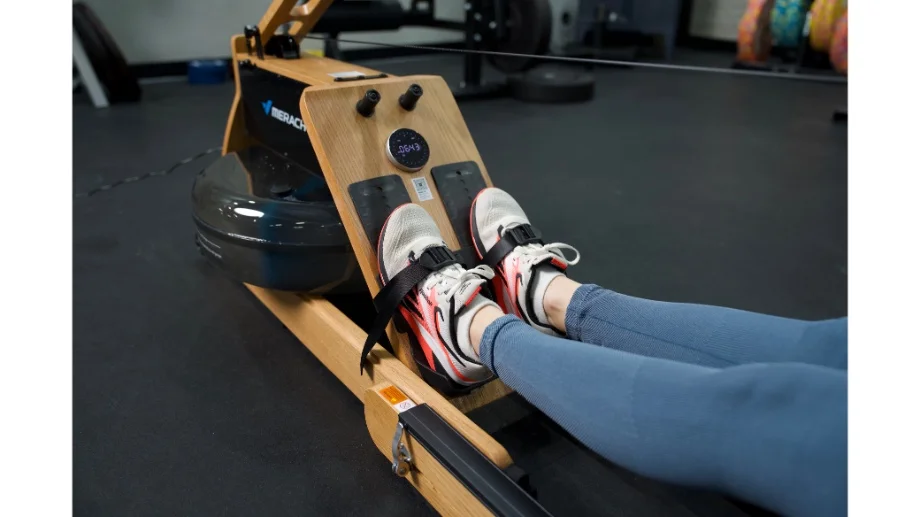 merach rower close up feet strapped in