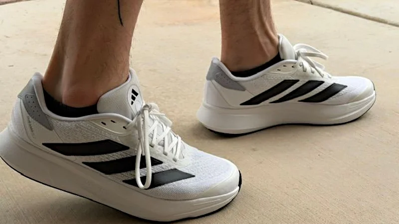 Walking in a pair of adidas Duramo SL2 shoes.