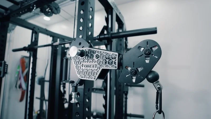 A close up view of the Force USA C20 materials showing the pulley arms, posts, and smith machine bar