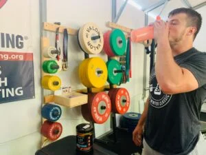 man drinking beyond raw lit