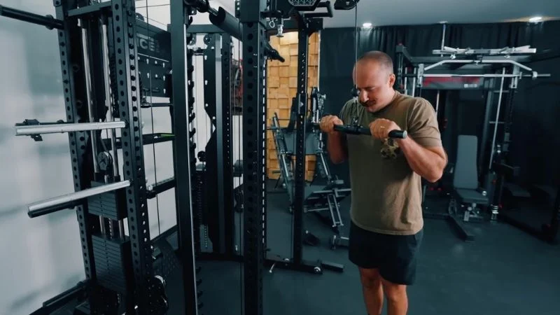Coop testing one of the Force USA C20 home gym's included attachments.