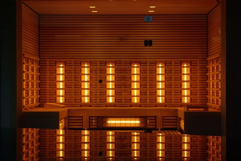 Photo featuring the inside of a large infrared sauna