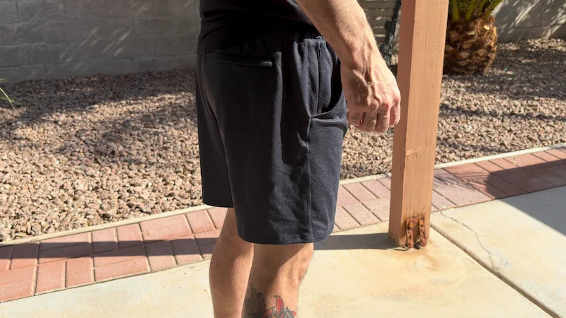 Matt Dustin wearing the Quince Flowknit Performance Shorts