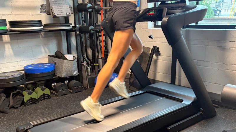 Our tester running on the Aviron Podium Treadmill