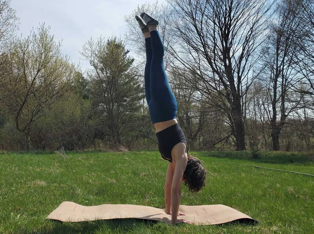 woman doing handstand in Sweaty Betty Zero Gravity leggings 