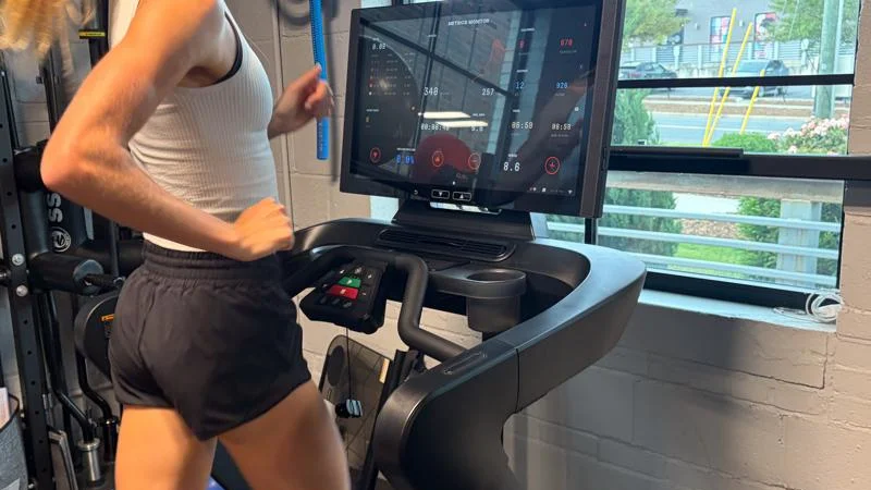 Our tester running on the Aviron Podium Treadmill