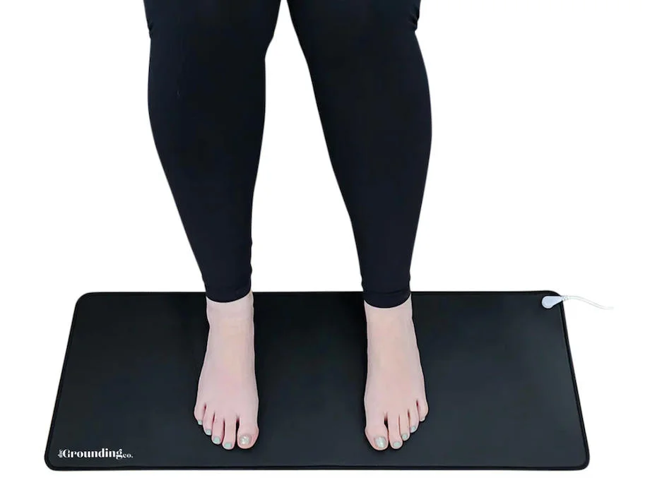 A person standing on a Terra Grounding Mat