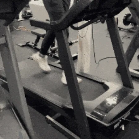 A person running on the  Horizon 7.0 AT treadmill. 