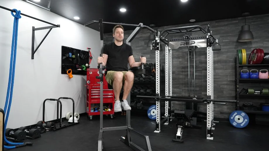 Man doing knee raises on the Proforma Power Tower