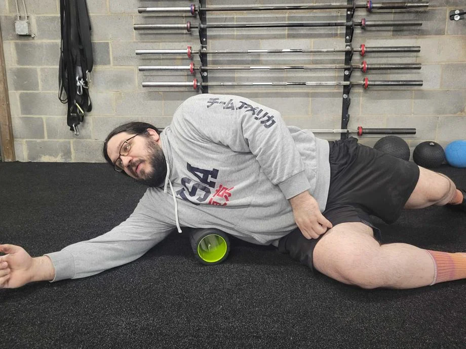 Olympian Caine Wilkes rolls his latissimus dorsi with the TriggerPoint Grid 1.0