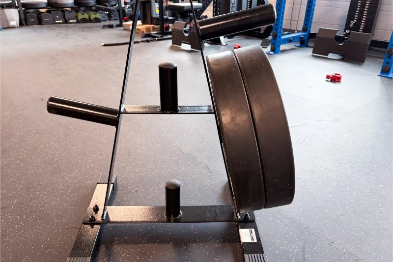 A CAP Olympic Plate Tree with large weights on the side.