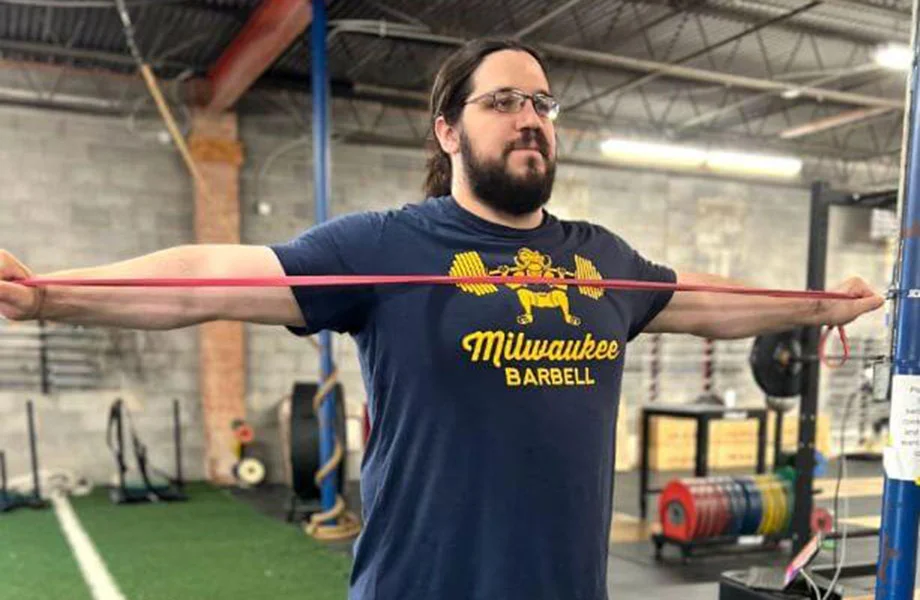 person doing band pull apart