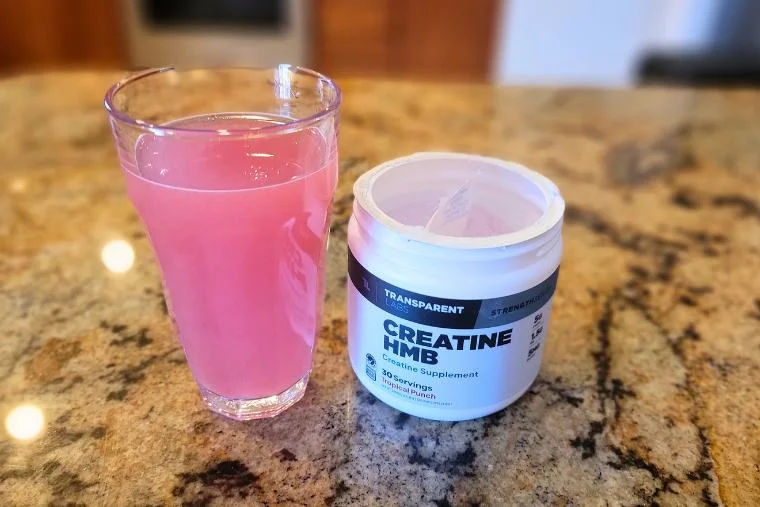 glass of transparent labs creatine hmb