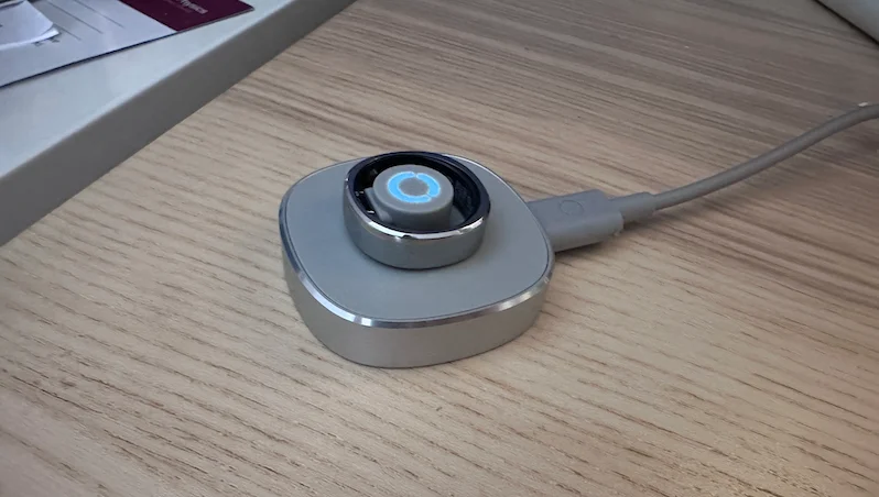 A RingConn Gen Air 2 dock on a wireless charger