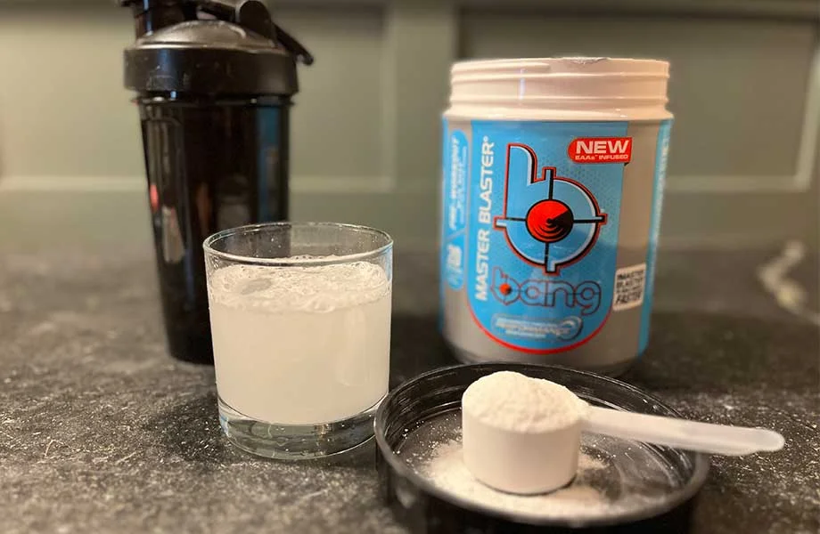 Bang Pre-Workout scoop and glass with container