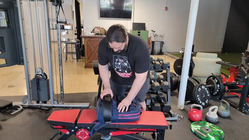 Olympian Caine Wilkes packs his gym bag.