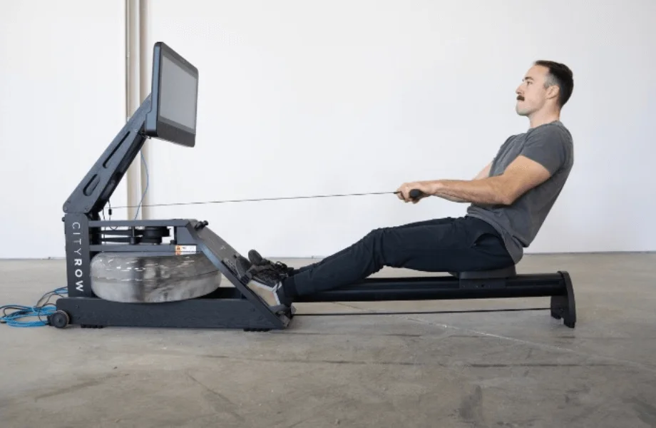Coop testing the CITYROW GO MAX rowing machine.
