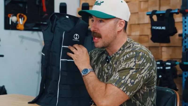 man-holding-the-hyperwear-hyper-vest-elite A man holding the Hyperwear Hyper Vest Elite