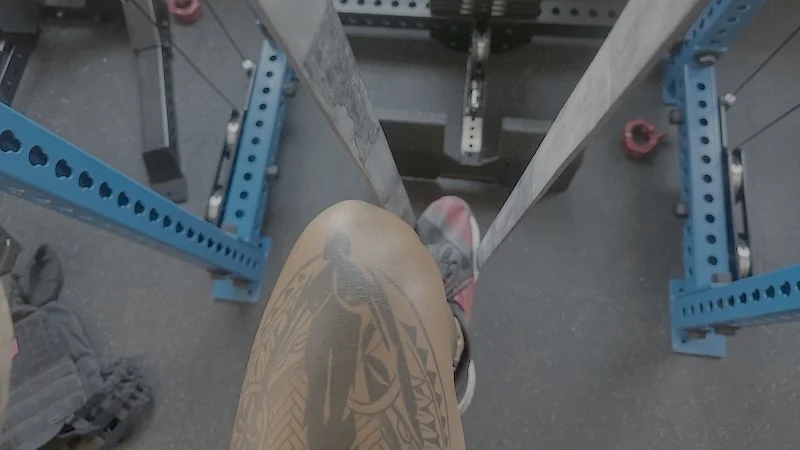 A person using the Rogue Black Monster Band for pull-up support