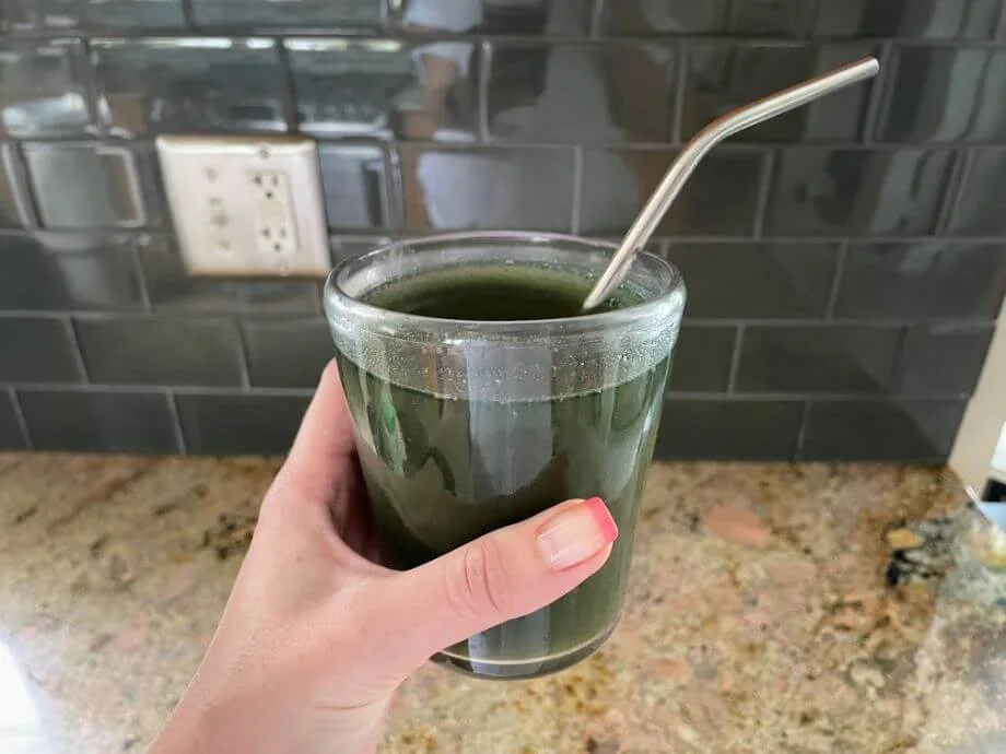 Woman Holding Bloom Greens