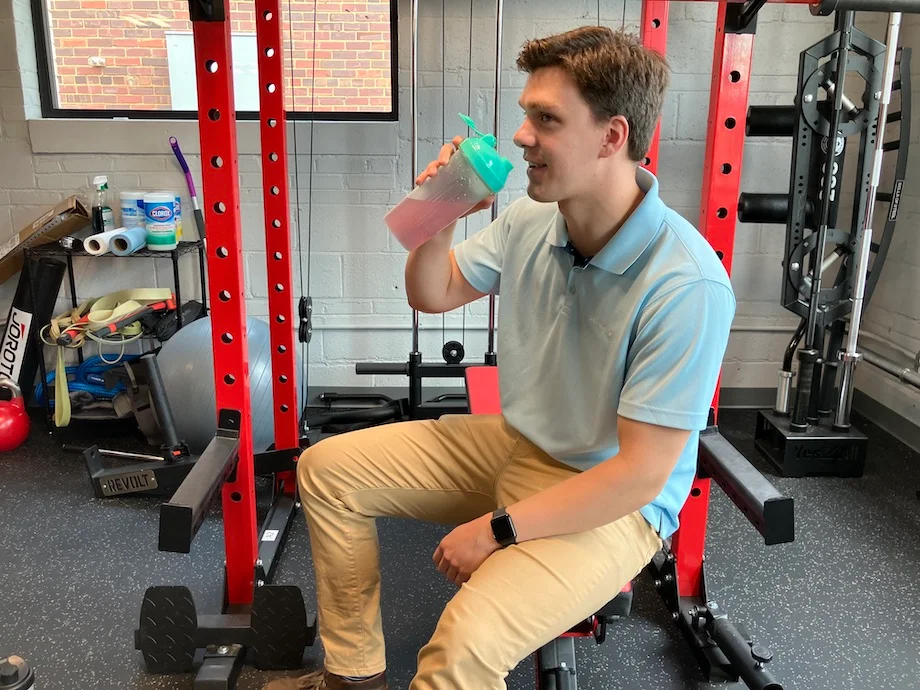 An image of a person drinking Sports Research Hydrate electrolytes
