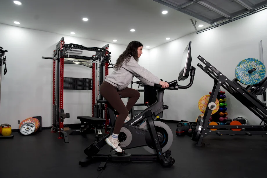 Woman riding the NordicTrack X24 exercise bike
