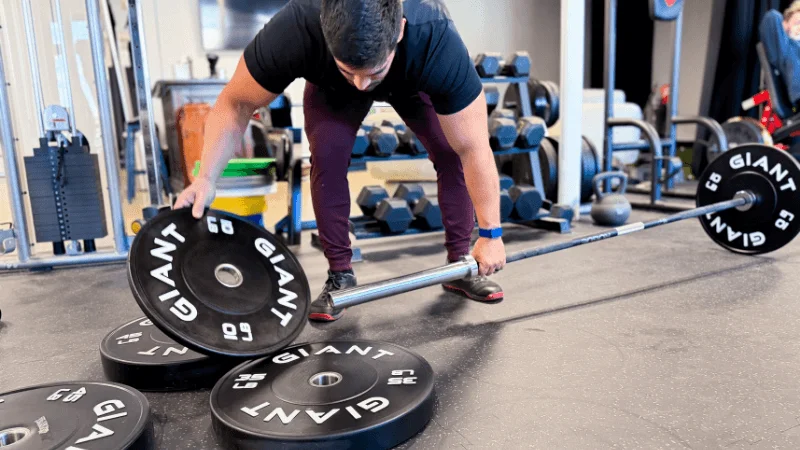 Our tester changing out some GIANT Lifting Base Bumper Plates mid-workout