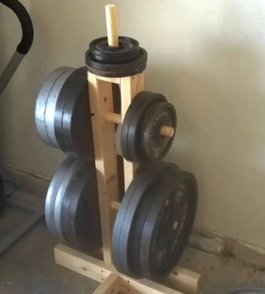 A wooden weight plate tree