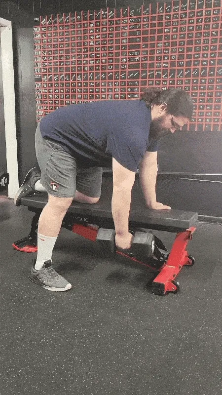 Man performing dumbbell one-arm rows