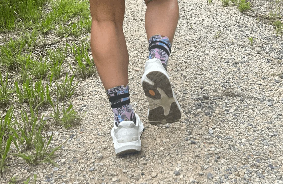A person running in a pair of Topo Athletic Ultraventure 4 trail running shoes