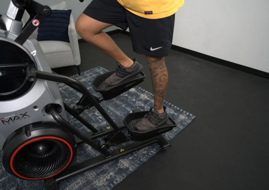 A close-up view of the pedals on the Boxflex Max Trainer M6