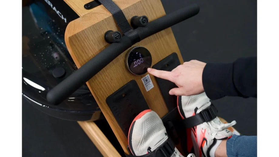 merach rower close up touching circle screen showing clock