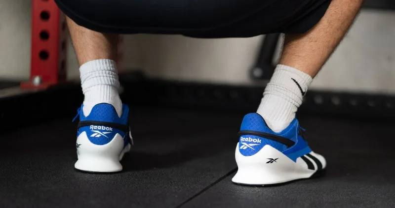 coop squatting with reebok legacy lifters
