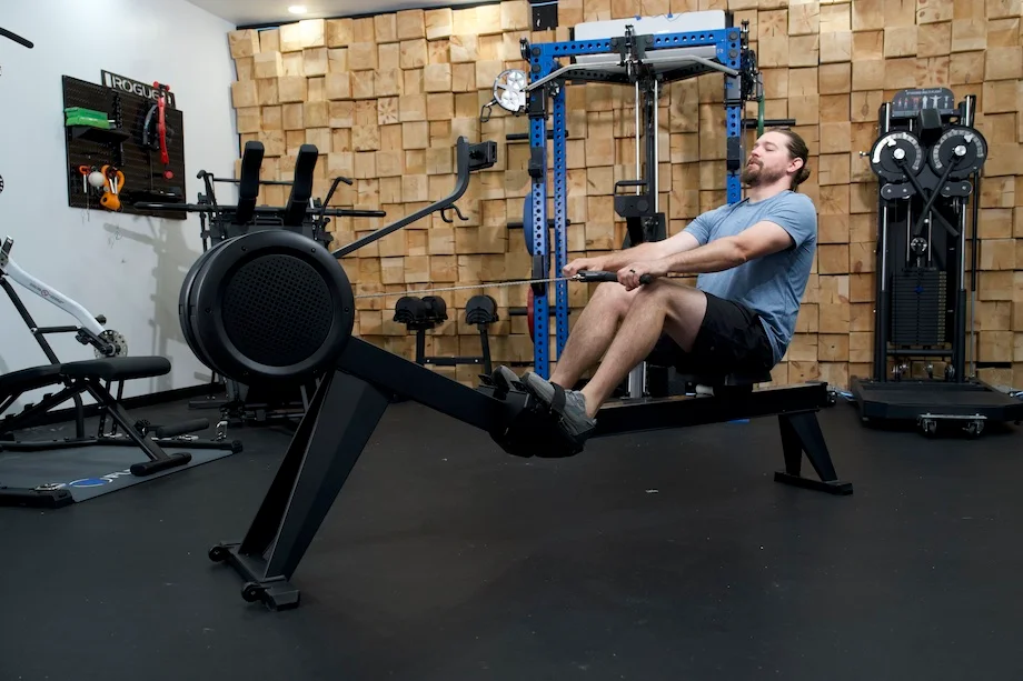 An image of a person rowing on the Yosuda Dragonfly rowing machine