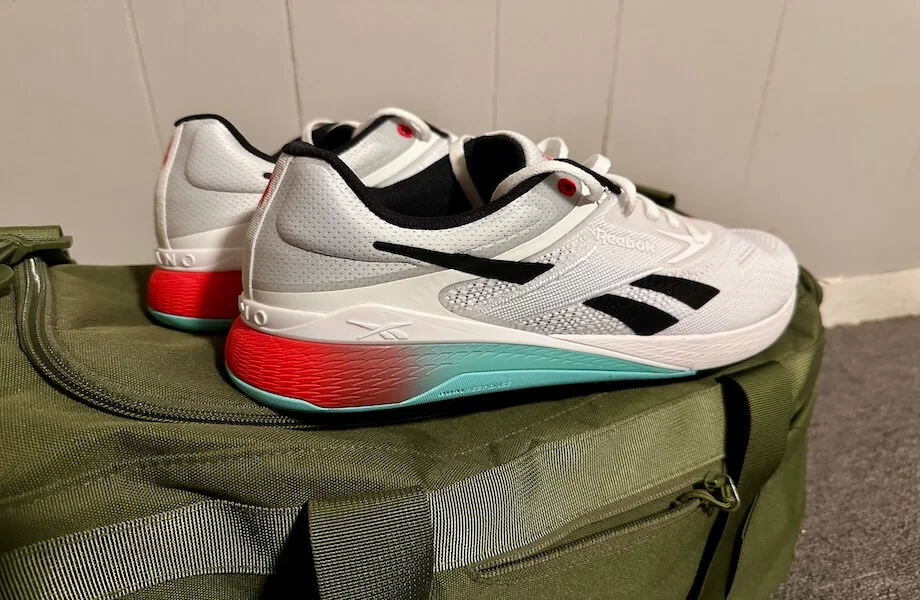 Reebok Nano X5 training shoes sitting atop a gym bag