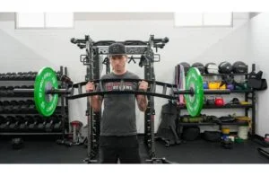 Bells of Steel Arch Nemesis Bar man holding