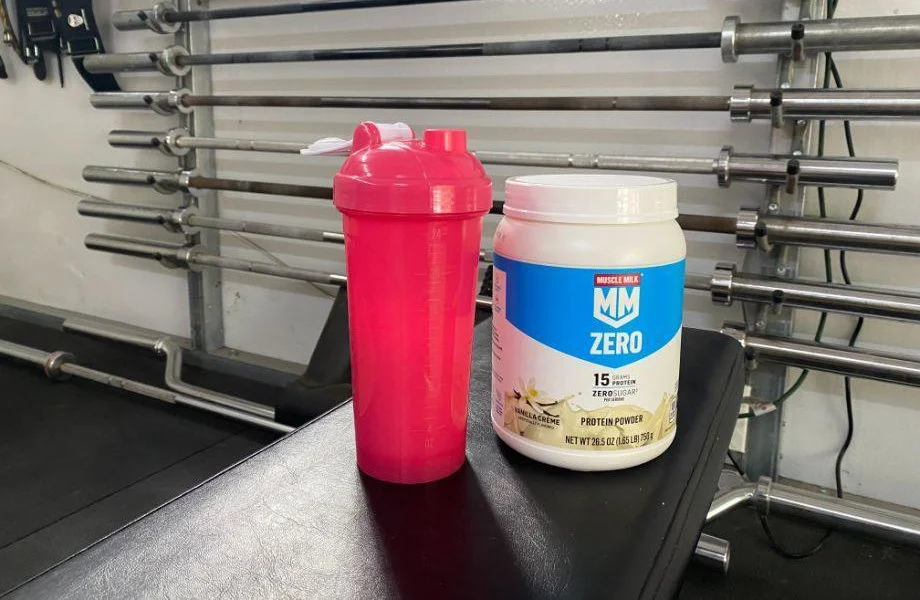 Muscle Milk Zero on a weight bench in a gym