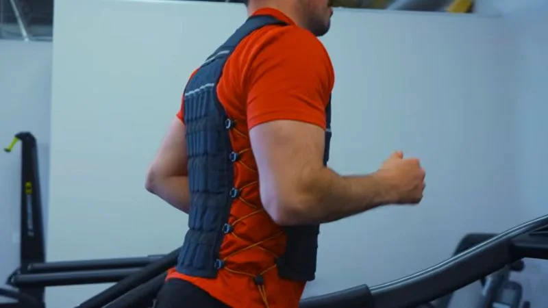 man-running-on-treadmill-in-hyperwear-hyper-vest-elite A man running on a treadmill while wearing the Hyperwear Hyper Vest Elite