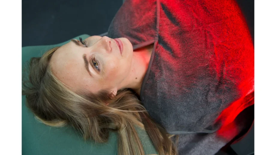 Woman in the Sunlighten Solo Sauna dome